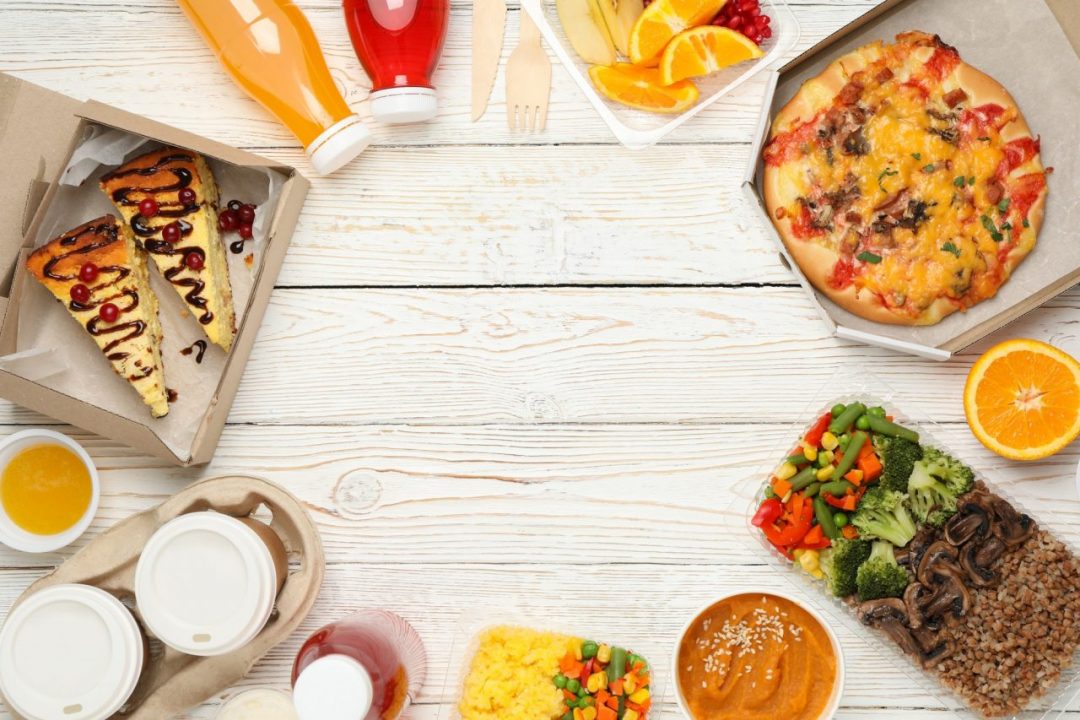 flat lay with takeaway food on wooden background food delivery